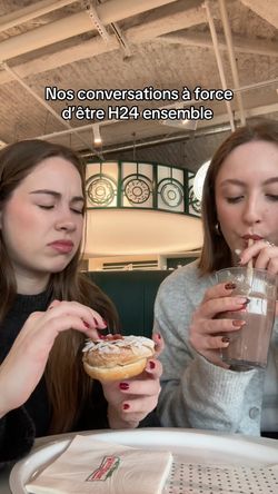 Enjoying doughnuts and beverages at Krispy Kreme, a café known for its desserts.